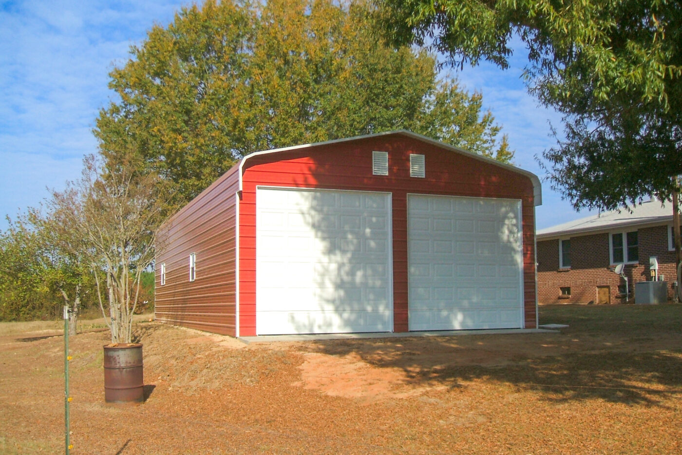 exterior of a red 2 car carport in sc for sale
